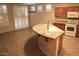 Open kitchen with a granite island and modern appliances at 4747 E Narrowleaf Dr, Gilbert, AZ 85298