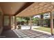 Large covered patio with view of the backyard landscaping and pavers at 4747 E Narrowleaf Dr, Gilbert, AZ 85298