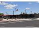 Community tennis courts and parking area on a sunny day with an American flag waving in the wind at 4747 E Narrowleaf Dr, Gilbert, AZ 85298