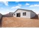 Home's back exterior featuring a cozy patio and potential for an expansive backyard oasis at 4811 W Hunter Trl, San Tan Valley, AZ 85144