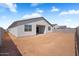 View of the home's back exterior and ample backyard space, ready for personalization and enjoyment at 4811 W Hunter Trl, San Tan Valley, AZ 85144