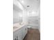 Bright bathroom featuring tiled floor, double sink vanity, tub, and modern fixtures at 4811 W Hunter Trl, San Tan Valley, AZ 85144