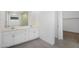 Modern bathroom featuring a double vanity, framed mirror, and tiled floor at 4811 W Hunter Trl, San Tan Valley, AZ 85144
