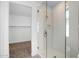 Sleek bathroom featuring glass shower with tile surround and walk-in closet at 4811 W Hunter Trl, San Tan Valley, AZ 85144