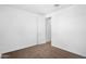 Empty bedroom featuring neutral carpet, white walls, and closet at 4811 W Hunter Trl, San Tan Valley, AZ 85144