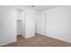 Spacious empty bedroom featuring neutral carpet, white walls, and closet at 4811 W Hunter Trl, San Tan Valley, AZ 85144