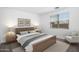 Stylishly furnished bedroom with a comfortable bed and decorative accents at 4811 W Hunter Trl, San Tan Valley, AZ 85144