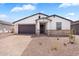 Charming single-story home with a two-car garage, desert landscaping, and a welcoming front entrance at 4811 W Hunter Trl, San Tan Valley, AZ 85144