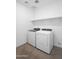 Laundry room featuring a washer, dryer, tile flooring, and shelf at 4811 W Hunter Trl, San Tan Valley, AZ 85144