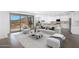 Beautifully staged living room with sliding glass doors to the backyard, modern furniture, and an open kitchen at 4811 W Hunter Trl, San Tan Valley, AZ 85144