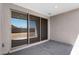 Covered patio featuring sliding glass doors and a view of the fenced backyard at 4811 W Hunter Trl, San Tan Valley, AZ 85144