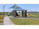 Community playground featuring climbing wall, slide and covered picnic tables for endless enjoyment at 4811 W Hunter Trl, San Tan Valley, AZ 85144