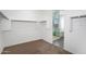 Walk-in closet with carpets, modern lighting fixtures, and access to bathroom at 4811 W Hunter Trl, San Tan Valley, AZ 85144