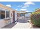 Well-maintained backyard with a brick patio, a charming garden, and access to a refreshing pool area at 502 W Windsor Ave, Phoenix, AZ 85003