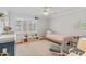 Bright bedroom with ample natural light, a cozy bed, chair, and playful decor at 502 W Windsor Ave, Phoenix, AZ 85003