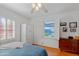 Charming bedroom featuring a window, closet, and a ceiling fan for ample light and comfort at 502 W Windsor Ave, Phoenix, AZ 85003