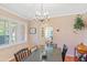 Dining room with chandelier, light walls, and hardwood floors at 502 W Windsor Ave, Phoenix, AZ 85003