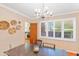 Inviting dining room with a chandelier, and plantation shutters at 502 W Windsor Ave, Phoenix, AZ 85003