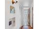 Bright hallway leading to the bathroom with patterned tile floor, and white walls at 502 W Windsor Ave, Phoenix, AZ 85003