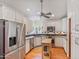 Spacious kitchen features stainless steel appliances, white cabinets, hardwood floors and a central island at 502 W Windsor Ave, Phoenix, AZ 85003