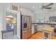 Bright kitchen boasts stainless steel appliances, including a large refrigerator, and ample white cabinetry at 502 W Windsor Ave, Phoenix, AZ 85003