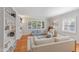 Bright living room with hardwood floors, large windows, and a comfortable seating arrangement at 502 W Windsor Ave, Phoenix, AZ 85003
