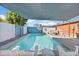 Sparkling backyard pool with lounge chairs, shaded area, and well maintained landscaping for ultimate relaxation at 502 W Windsor Ave, Phoenix, AZ 85003