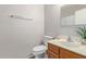 Cozy bathroom featuring a single sink, toilet, mirror, towel bar, and shower with a white curtain at 5136 E Evergreen St # 1142, Mesa, AZ 85205
