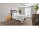 Calm and inviting bedroom with a ceiling fan, a large window, and a minimalist headboard at 5136 E Evergreen St # 1142, Mesa, AZ 85205