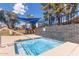 Community hot tub with a blue awning, a fence, and green trees on a sunny day at 5136 E Evergreen St # 1142, Mesa, AZ 85205