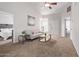 Bright living room featuring neutral tones, a ceiling fan, and views into a bedroom at 5136 E Evergreen St # 1142, Mesa, AZ 85205