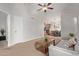 Cozy living room with a ceiling fan that flows seamlessly into the kitchen and dining area at 5136 E Evergreen St # 1142, Mesa, AZ 85205