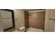 Bathroom showcasing a tiled tub surround with updated fixtures and towel rack at 5435 W Christy Dr, Glendale, AZ 85304