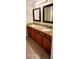 Bathroom featuring a double sink vanity with granite countertop and tile flooring at 5435 W Christy Dr, Glendale, AZ 85304