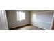 Bright room with wood floors, a window, and white trim at 5435 W Christy Dr, Glendale, AZ 85304
