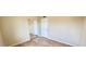 Cozy bedroom featuring wood laminate flooring and a mirrored closet at 5435 W Christy Dr, Glendale, AZ 85304