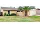 Charming single-story home with a tidy front lawn and mature palm tree at 5435 W Christy Dr, Glendale, AZ 85304