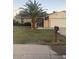 Charming home featuring a well-manicured lawn and mature palm tree at 5435 W Christy Dr, Glendale, AZ 85304