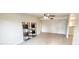 Bright living room with tile flooring and stylish shelving at 5435 W Christy Dr, Glendale, AZ 85304