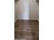 An empty walk-in closet with laminate floors at 5435 W Christy Dr, Glendale, AZ 85304