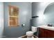 Powder room featuring hard surface floor, toilet and small vanity at 5440 W Apollo Rd, Laveen, AZ 85339