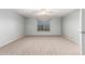Bright, spacious bedroom features a window and plush carpeting, creating a cozy, comfortable space at 5440 W Apollo Rd, Laveen, AZ 85339