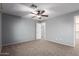 Neutral bedroom featuring ceiling fan, and doorway to closet at 5440 W Apollo Rd, Laveen, AZ 85339