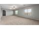 Spacious bonus room filled with natural light showcases plush carpeting and versatile living space at 5440 W Apollo Rd, Laveen, AZ 85339