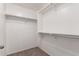Efficient closet space with rods and shelves for clothing storage and organization at 5440 W Apollo Rd, Laveen, AZ 85339