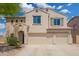 Charming two-story home boasting three-car garage and meticulously manicured landscaping at 5440 W Apollo Rd, Laveen, AZ 85339