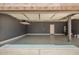 Spacious garage featuring painted walls and a door to the interior of the home at 5440 W Apollo Rd, Laveen, AZ 85339