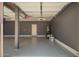 Spacious garage featuring painted walls and a door to the interior of the home at 5440 W Apollo Rd, Laveen, AZ 85339