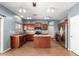 Spacious kitchen featuring wood cabinets, stainless appliances, tile floors and island at 5440 W Apollo Rd, Laveen, AZ 85339