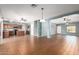 Open-concept living room with tiled floors and multiple ceiling fans at 5440 W Apollo Rd, Laveen, AZ 85339